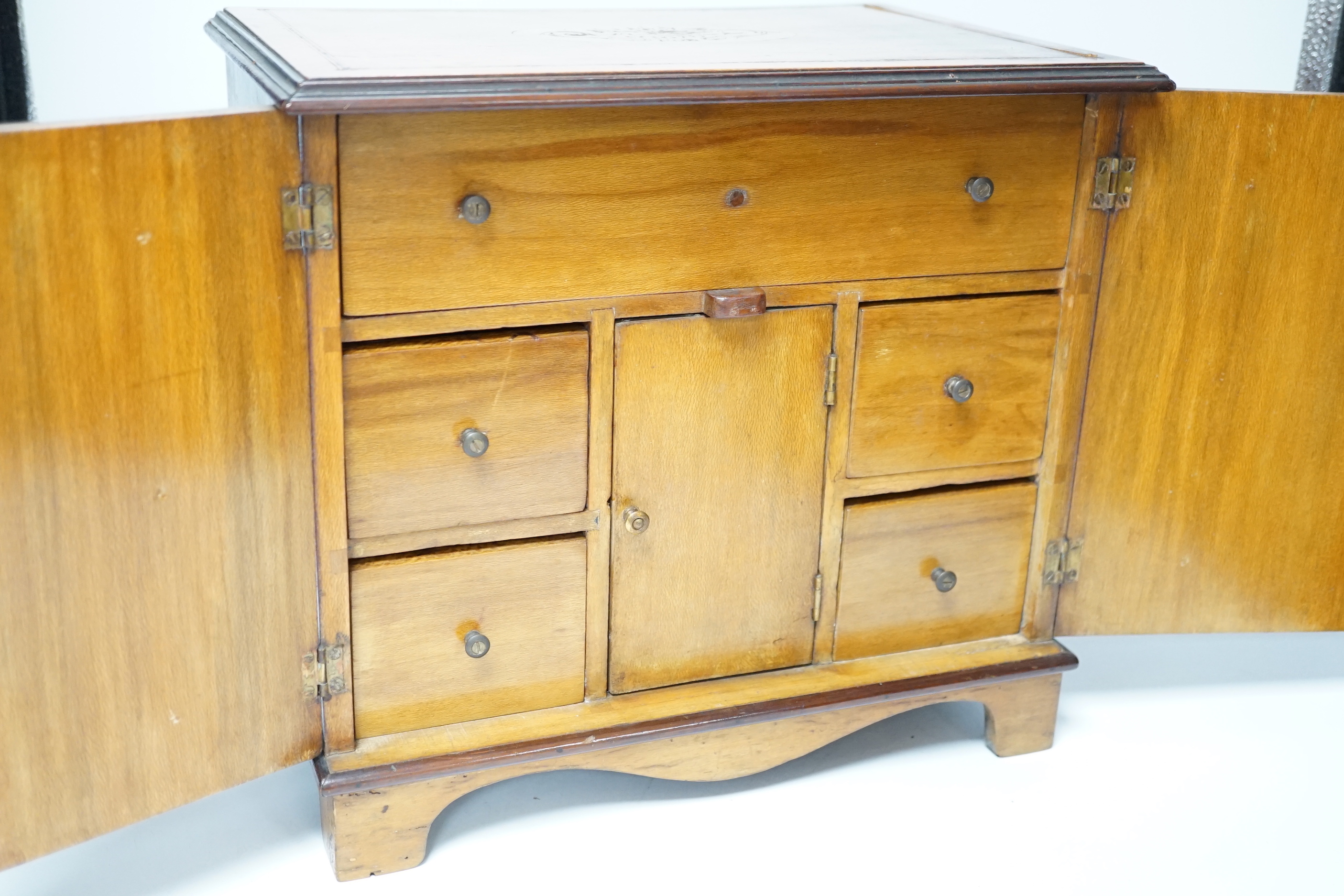 An Edwardian inlaid sycamore two door jewellery chest, 29cm high x 31cm wide